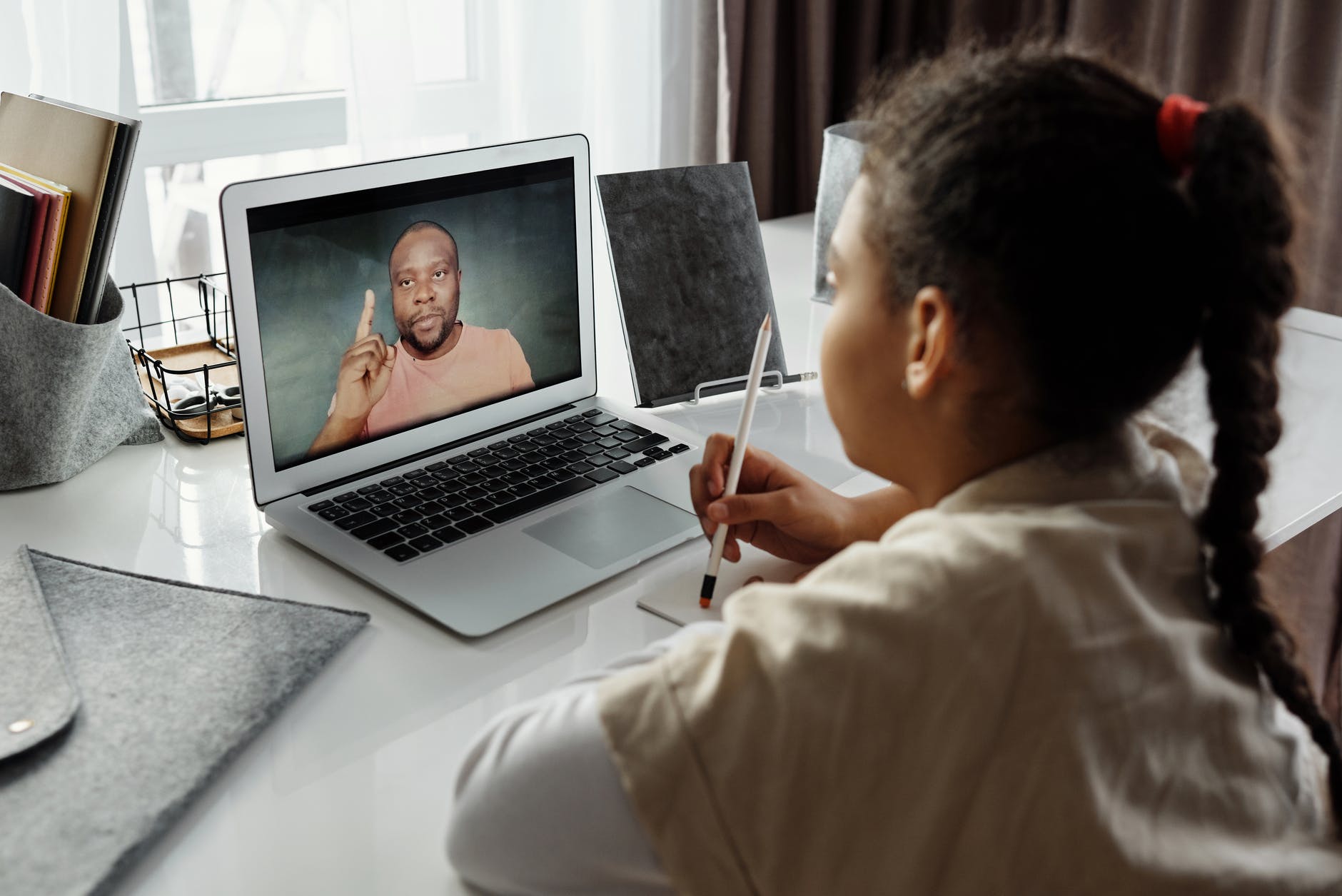 little Black girl taking classes online